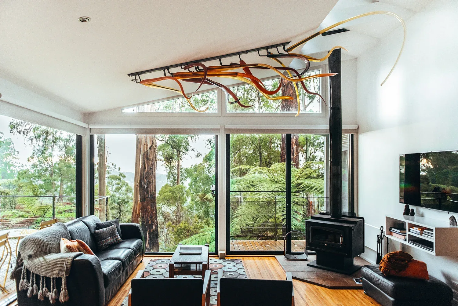 The living space opens to views of trees.