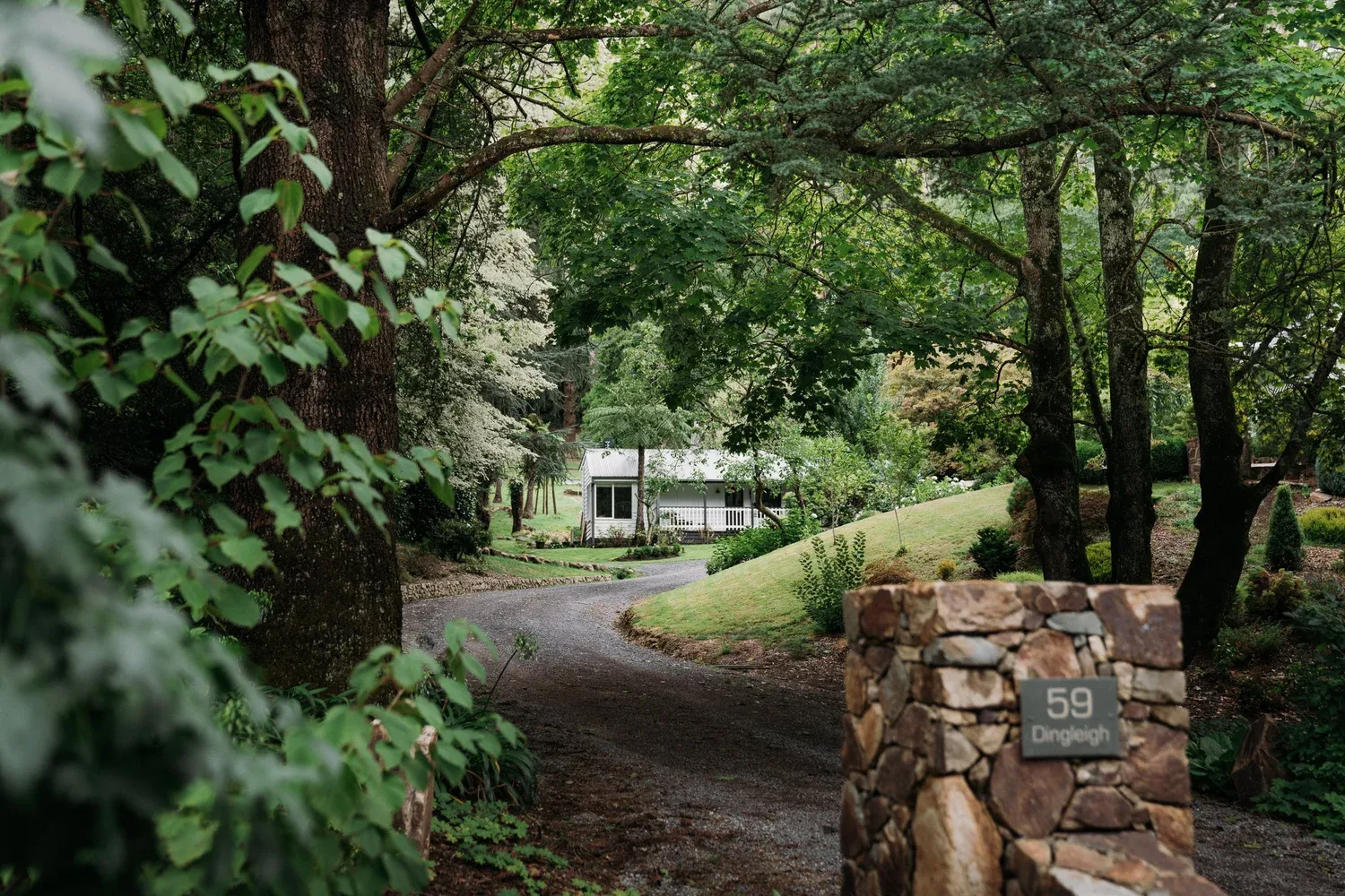 Stone entrance pillars and a curved drive at Dingleigh.