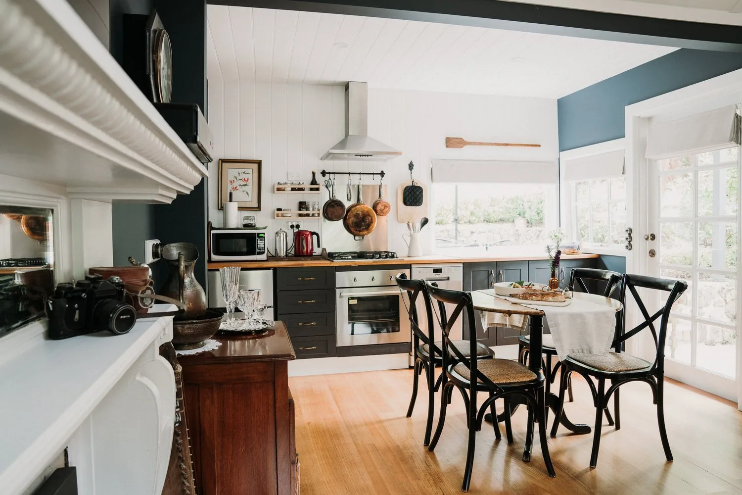 A kitchen and dining area with timber floors.