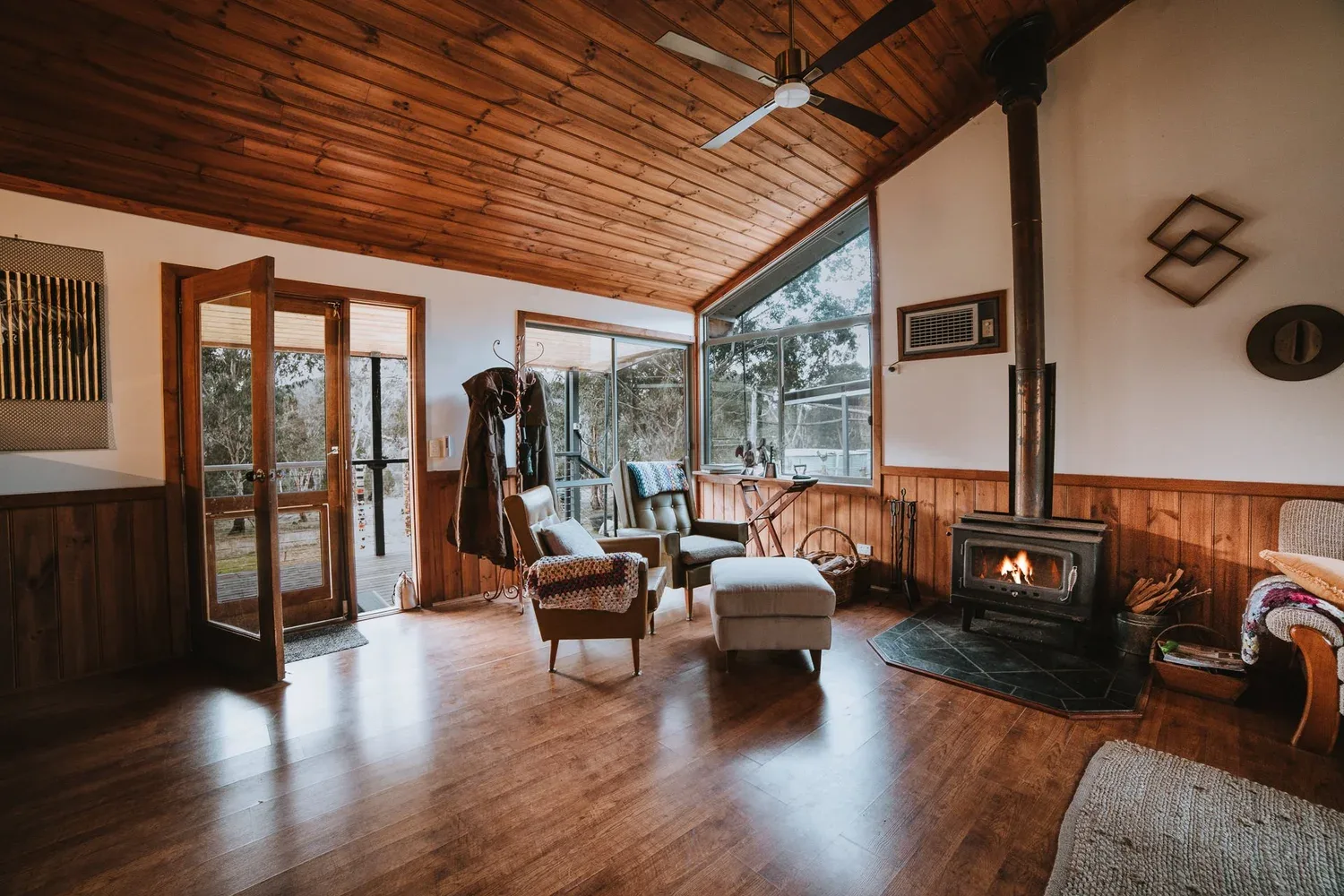Timber surfaces and leather seating in the living space.