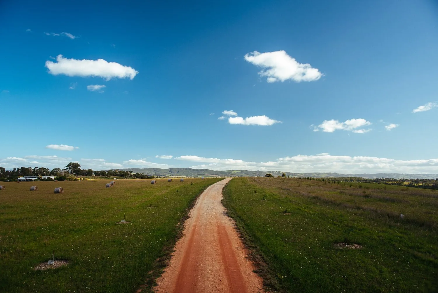 A straight track through the open rural landscape.